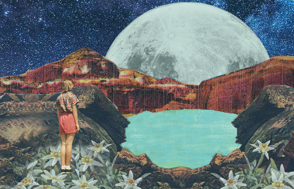 Woman standing on mountain looking a the moon